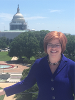 A picture of NCTE Executive Director Emily Kirkpatrick from the roof deck of our new DC office. 